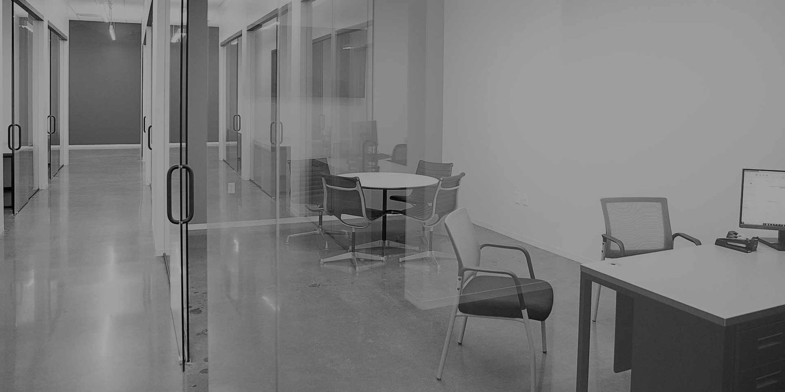 Office hallway with glass walls and doors