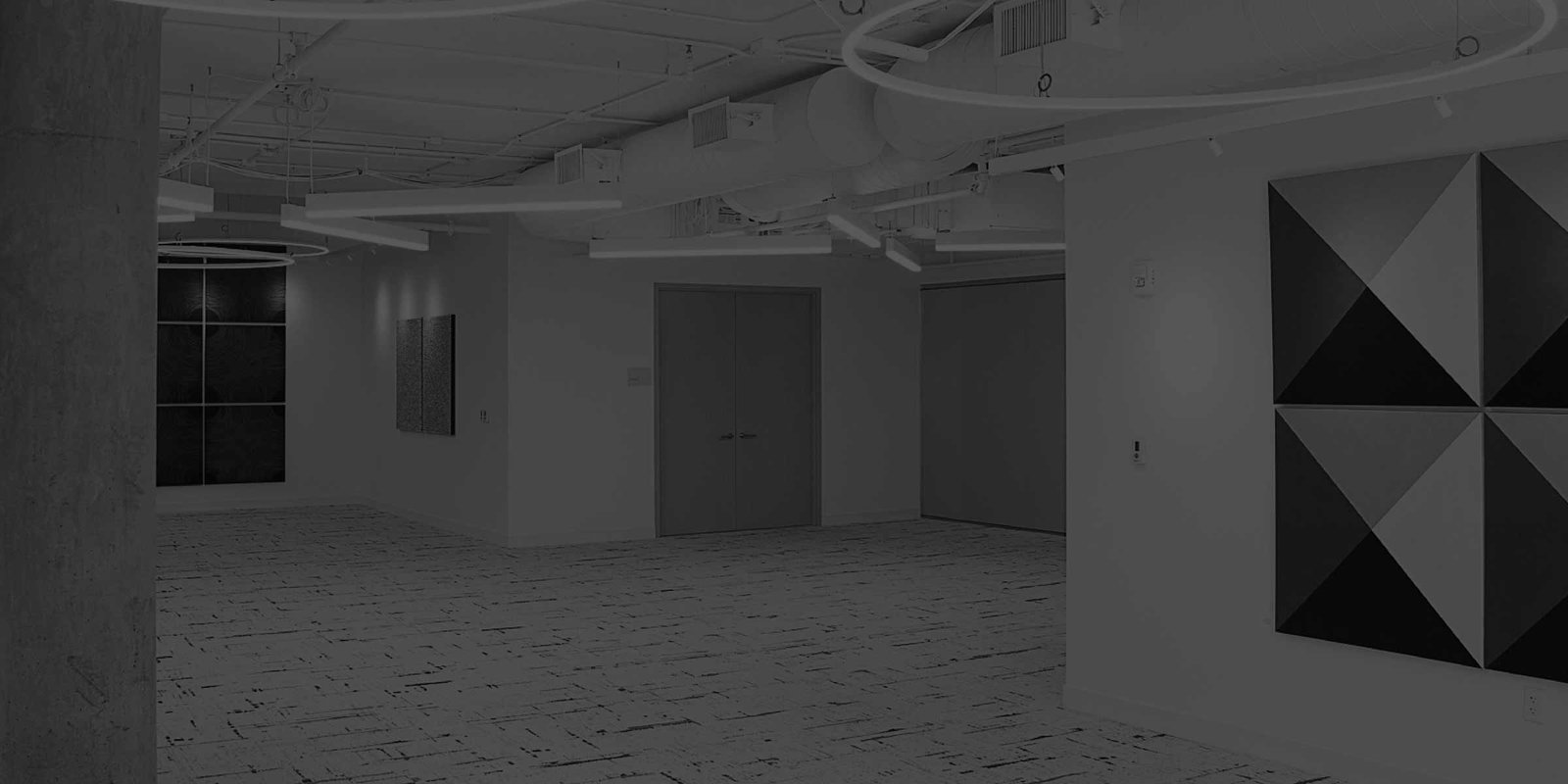 Empty office interior with lighting and art on wals