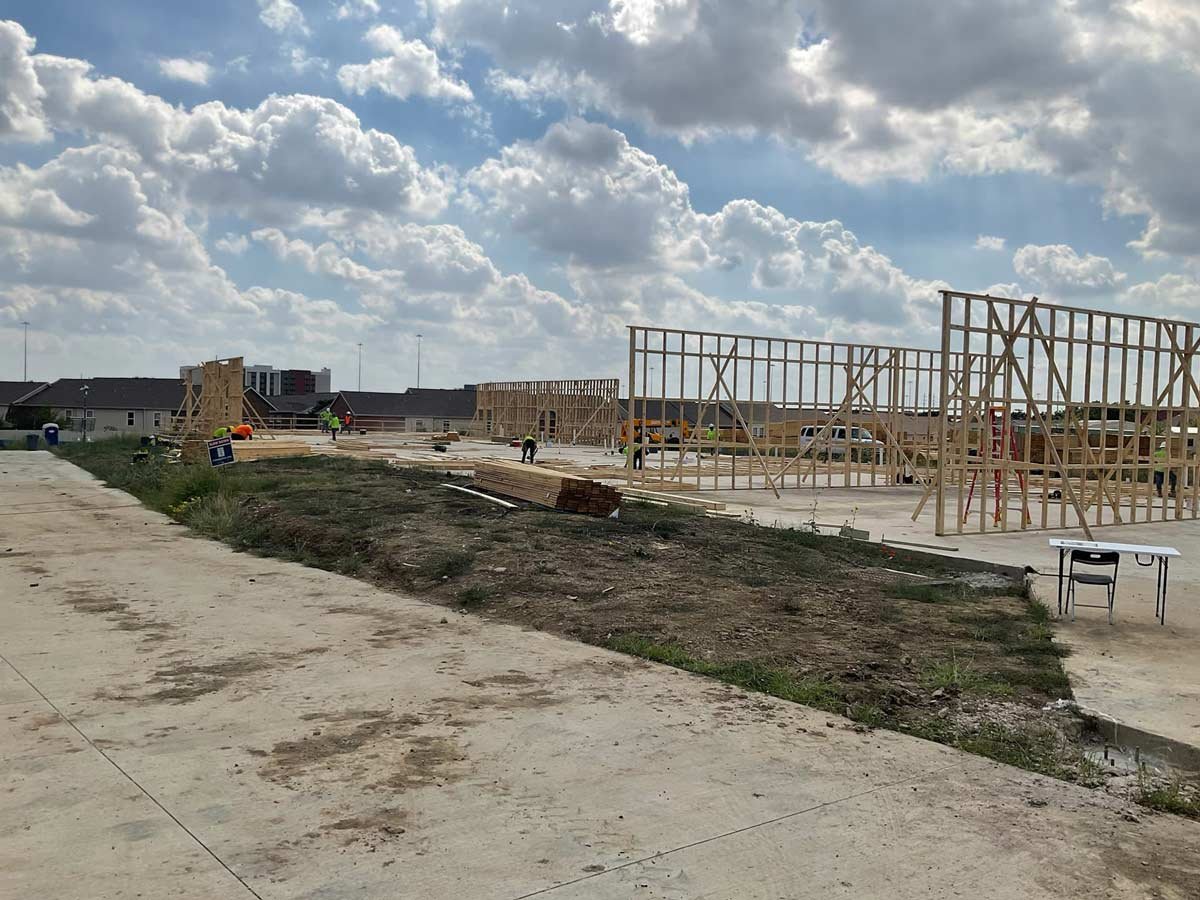 Framing on slab on sunny day with big clouds