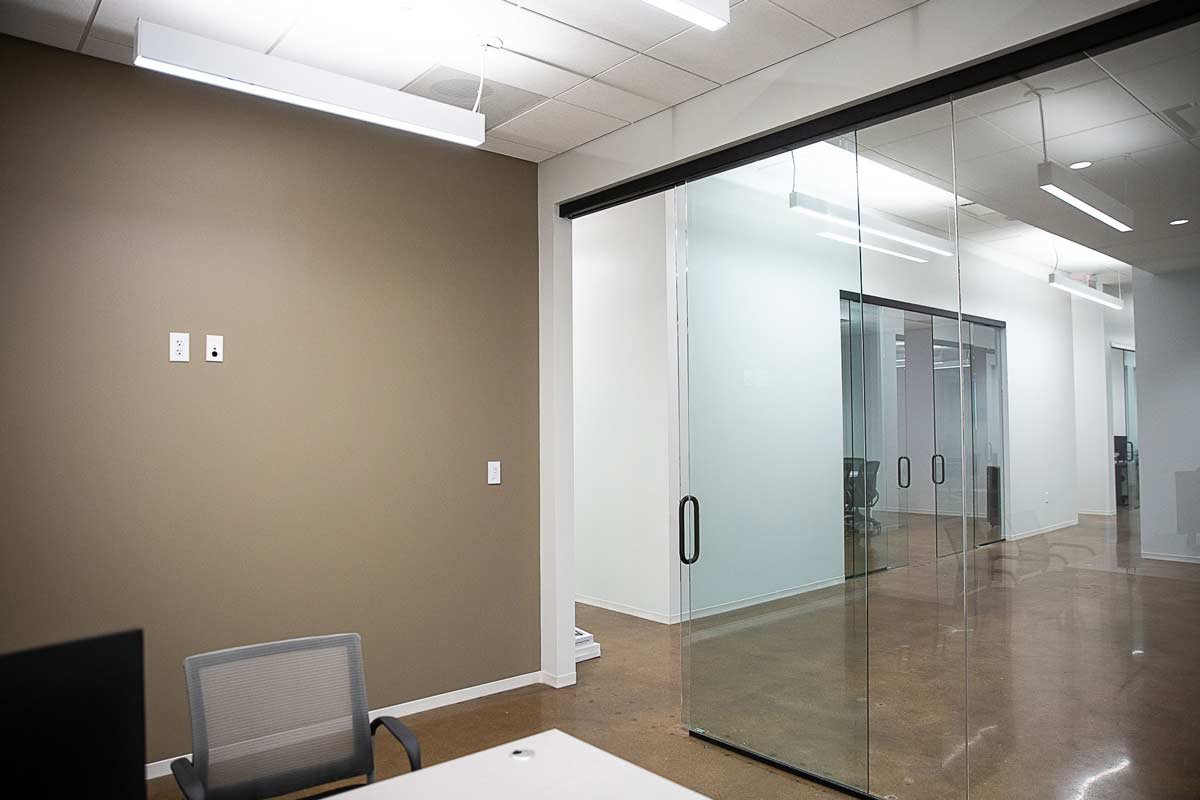 Office with glass wall view into the hallway