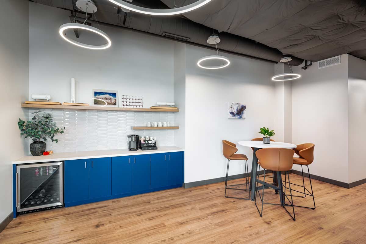 Office kitchen with sink, fridge and table