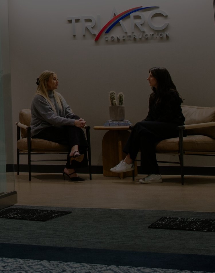 Two women chatting in the TriArc side room